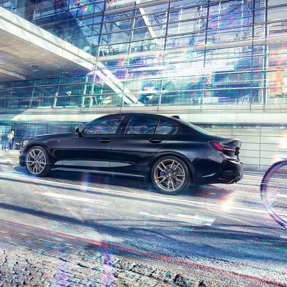 BMW 3 Series Sedan, BMW M340i xDrive G20. Side view of the BMW M340i xDrive in front of an urban building G20.