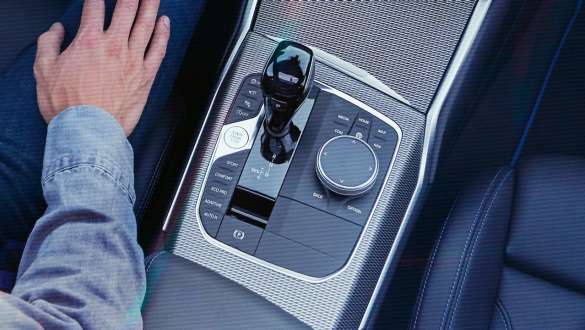 BMW 3 Series Sedan, Steptronic Sport transmission G20. Detailed bird's eye view of the centre console of the BMW 3 Series Sedan with gear lever and Steptronic Sport transmission G20.