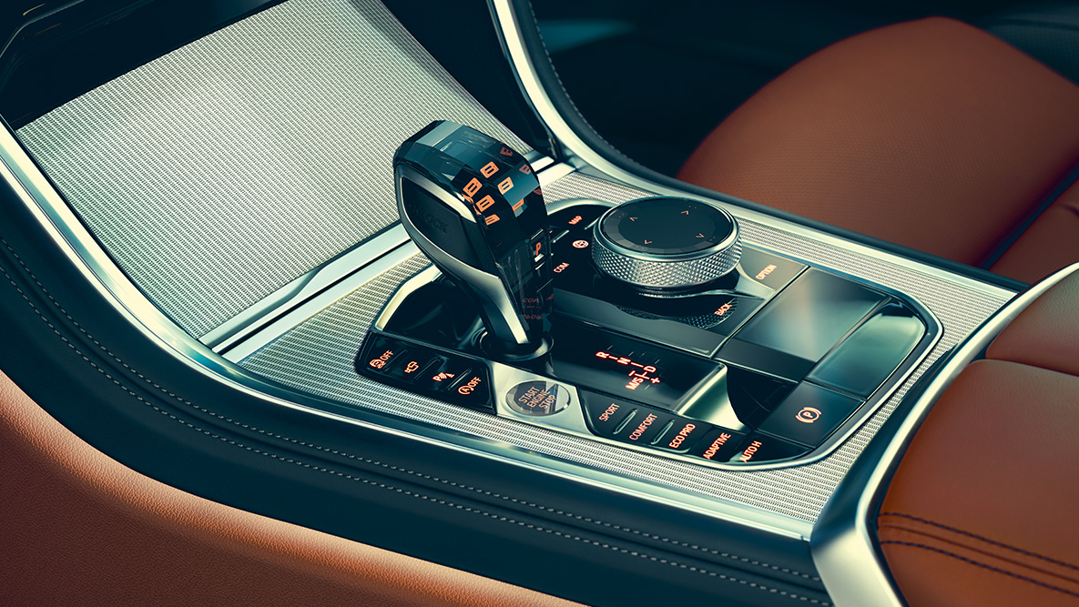 BMW 8 серии Coupe, центральная консоль Интерьер BMW 8 серии Coupe крупным планом с фокусом на центральную консоль.