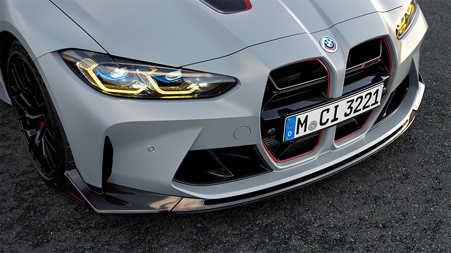 BMW M4 CSL G82, "BMW Individual Морозный Серый Бруклин металлик", карбоновый передний сплиттер M, крупный план, вид спереди