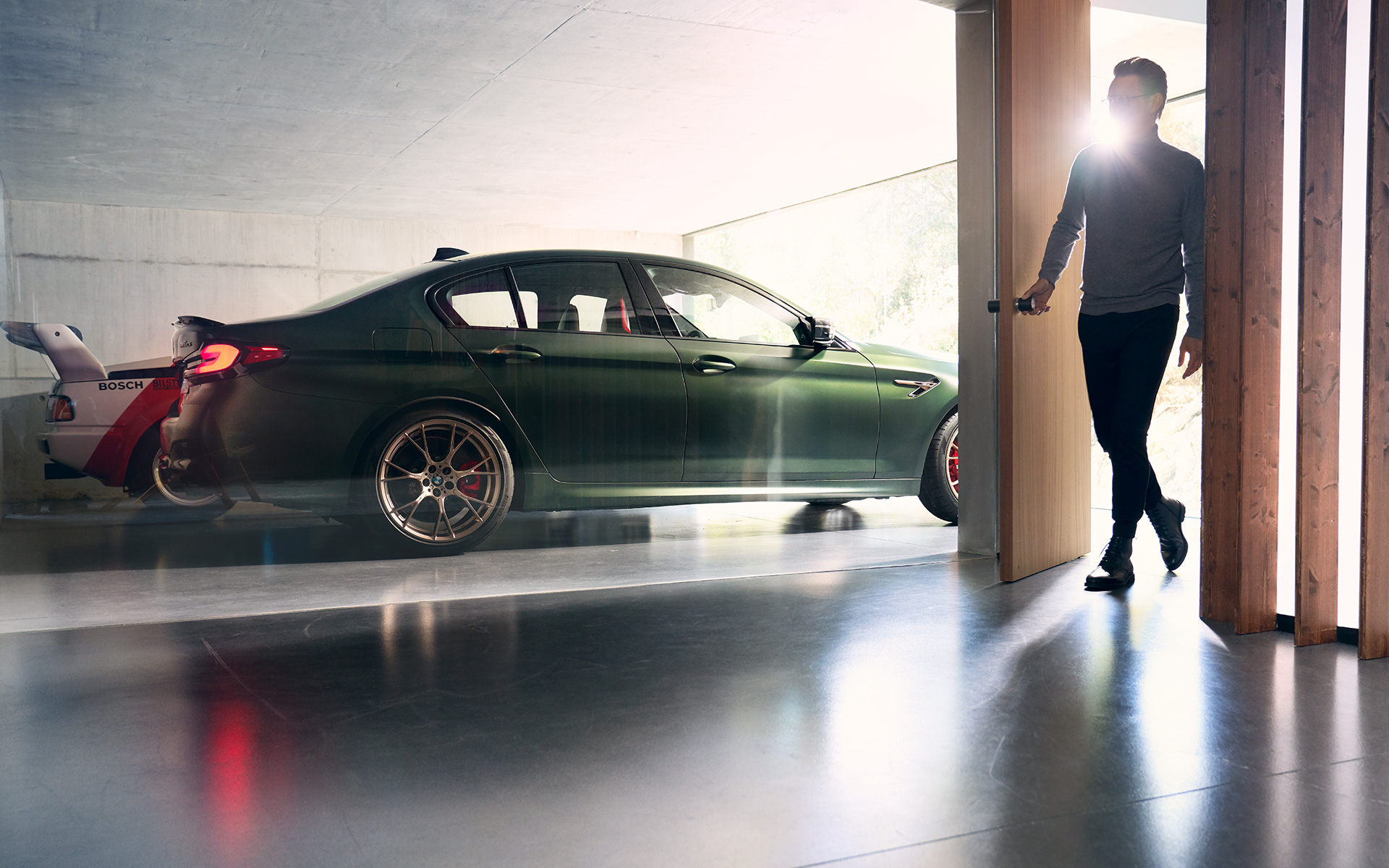 BMW M5 CS F90 2021 Frozen Deep Green metallic side view in garage