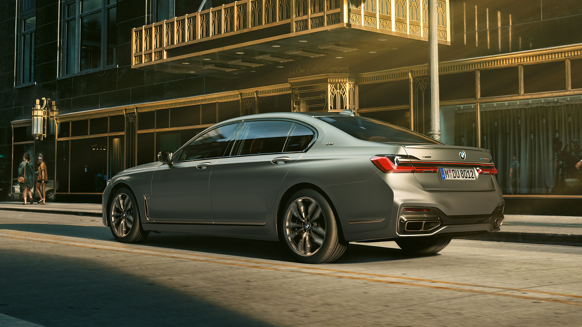 BMW M760Li xDrive Sedan with V12 engine G12 BMW M760Li xDrive Sedan, lateral rear view in front of skyscrapers in urban setting G12